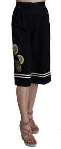 Pantalon court en coton noir Dolce & Gabbana avec embellissements, mode élégante et sophistiquée.