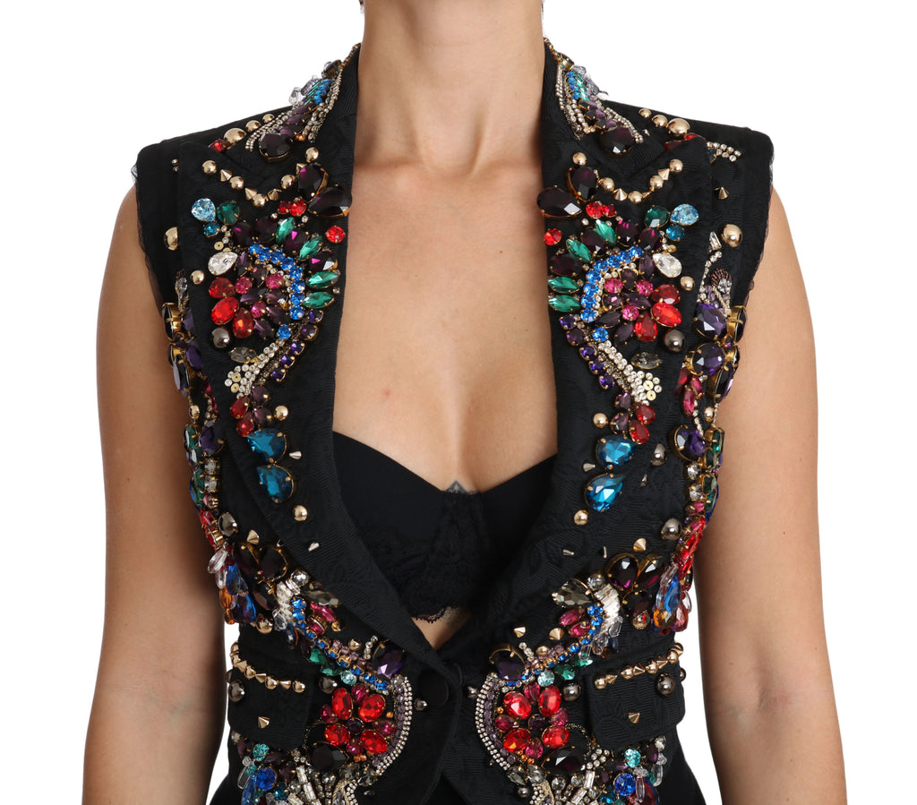Gilet Dolce & Gabbana Sicily en noir avec cristaux, coupe ajustée, porté sur un fond neutre.