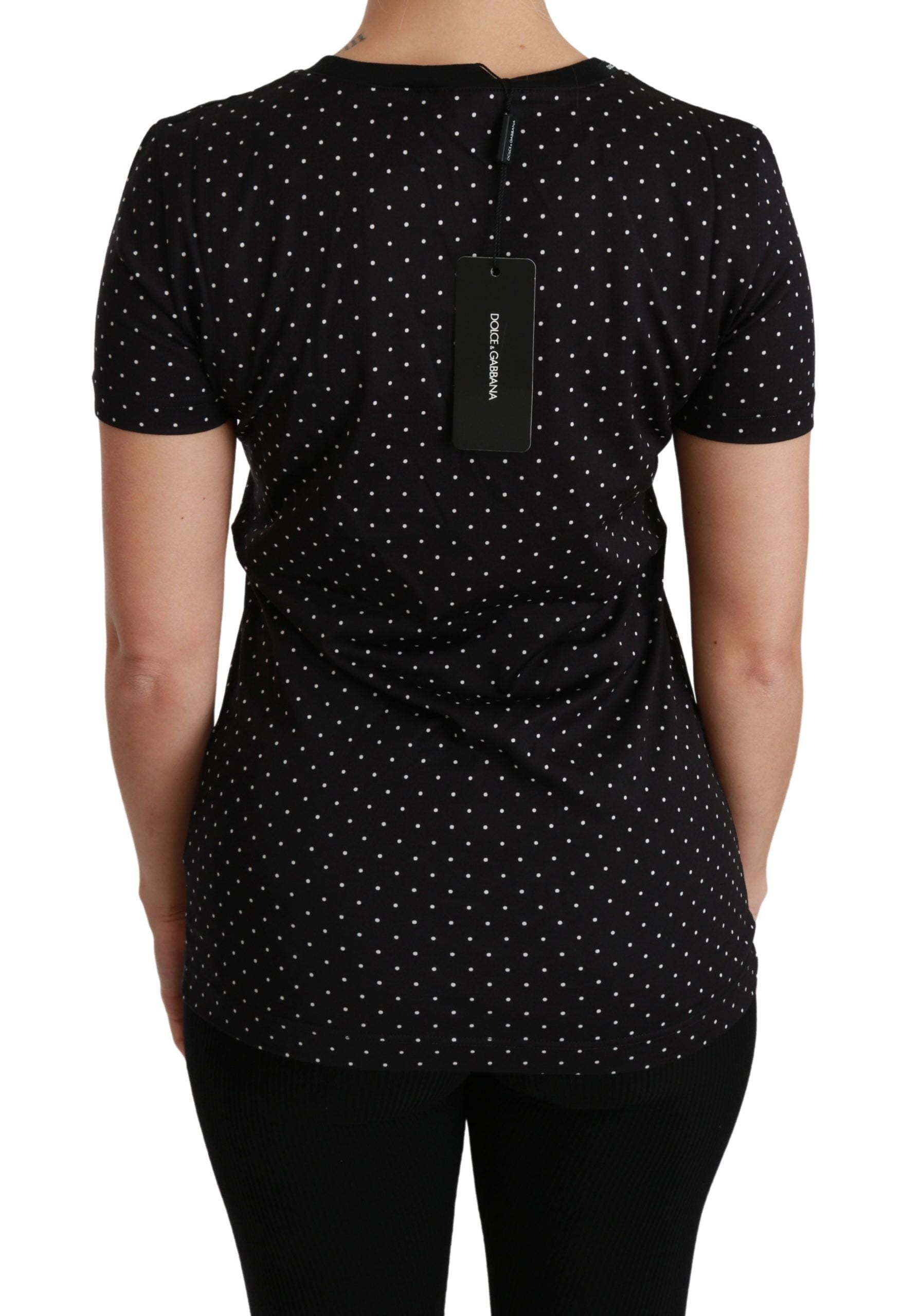 T-shirt noir à pois Dolce & Gabbana en coton avec col rond, détail visible sur le haut de la poitrine.