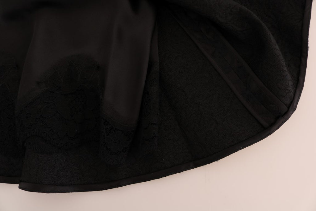 Jupe trapèze en jacquard de soie noire à motifs floraux, signature Dolce & Gabbana, élégante et sophistiquée.