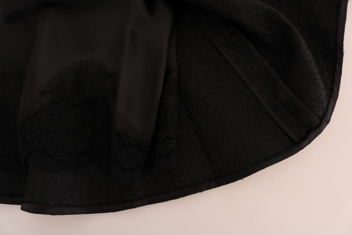 Jupe trapèze en jacquard de soie noire à motifs floraux, signature Dolce & Gabbana, élégante et sophistiquée.