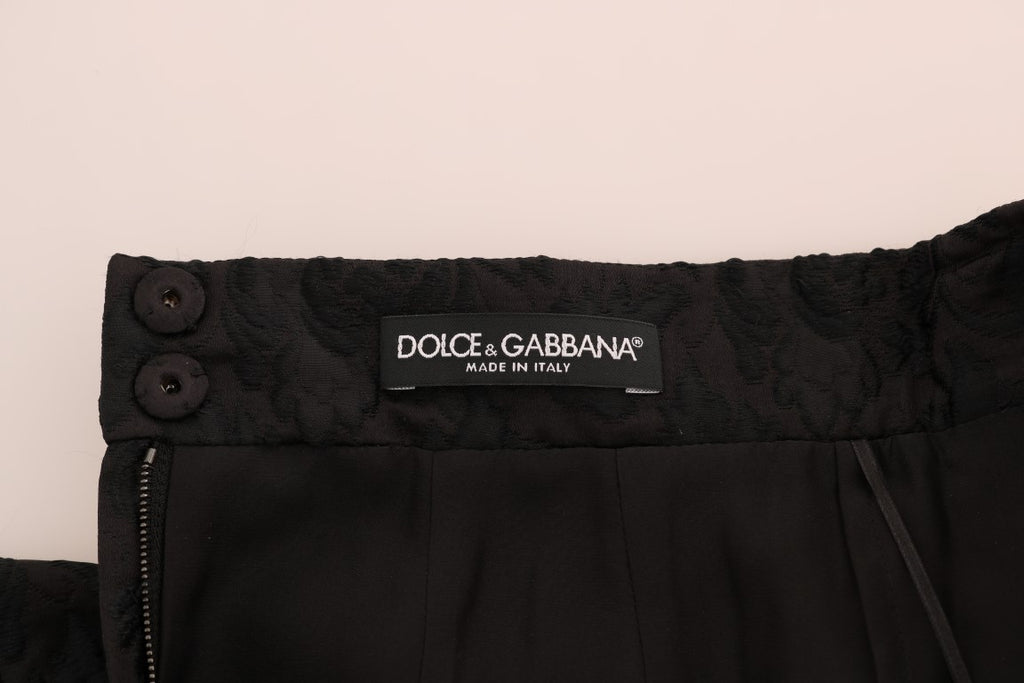Jupe en jacquard de soie noire à fleurs Dolce & Gabbana, coupe trapèze élégante et raffinée.