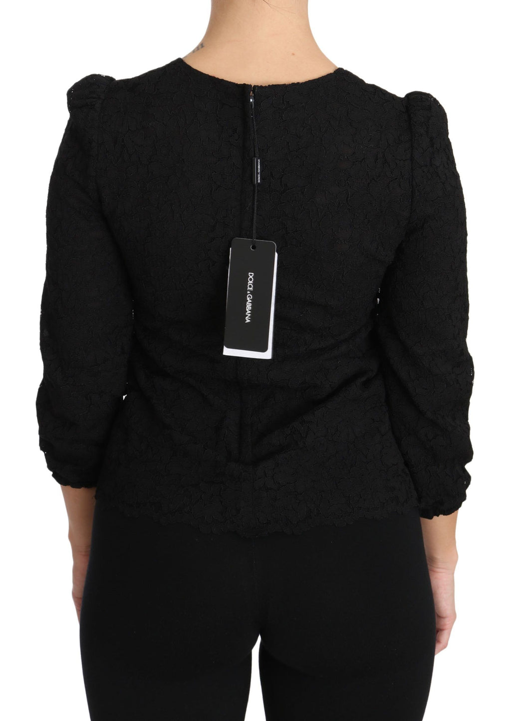 Blouse noire Dolce & Gabbana avec dentelle florale, fermeture éclair et style élégant.