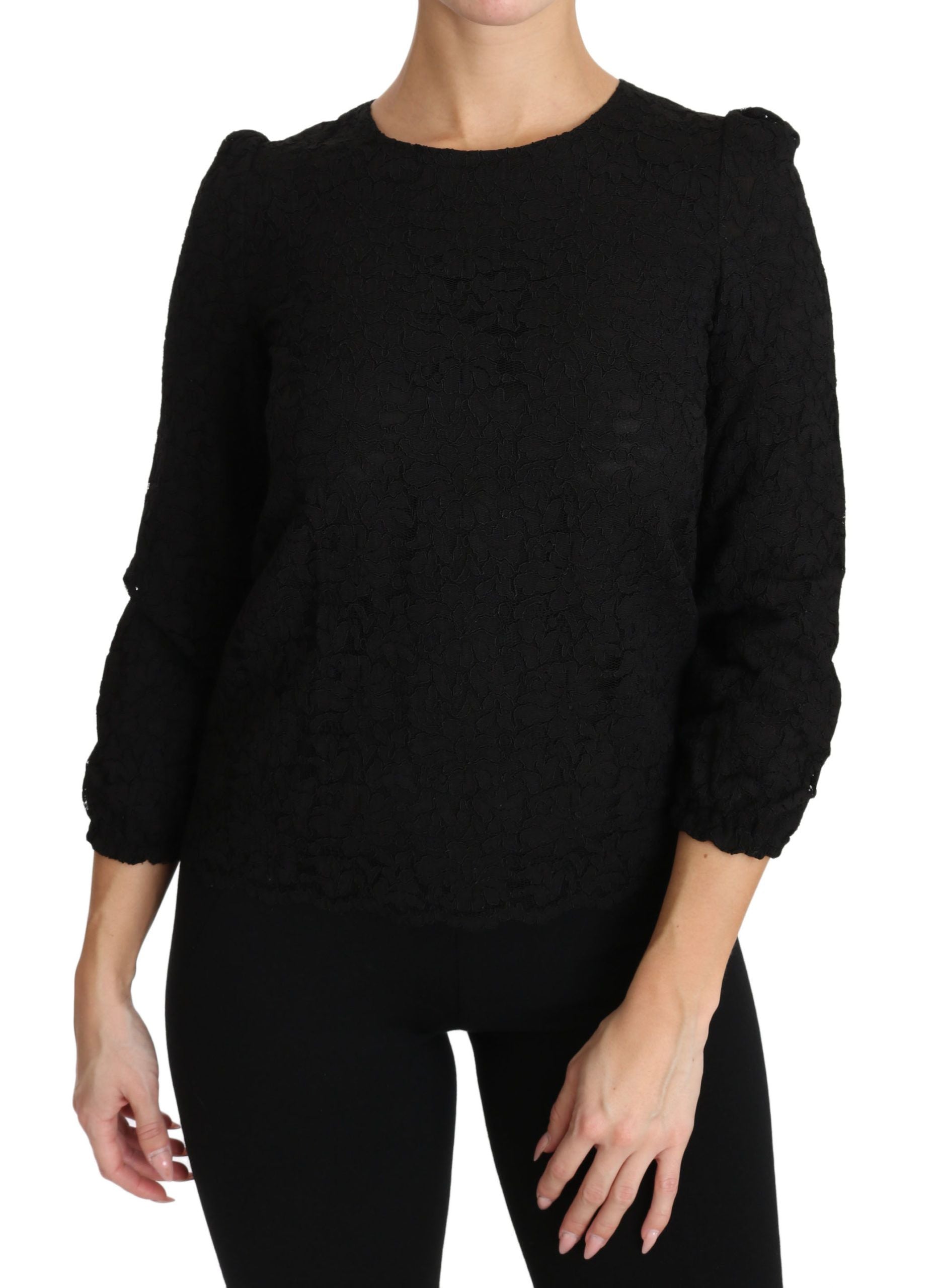 Blouse noire en dentelle florale avec fermeture éclair de la marque Dolce & Gabbana, vue de face.