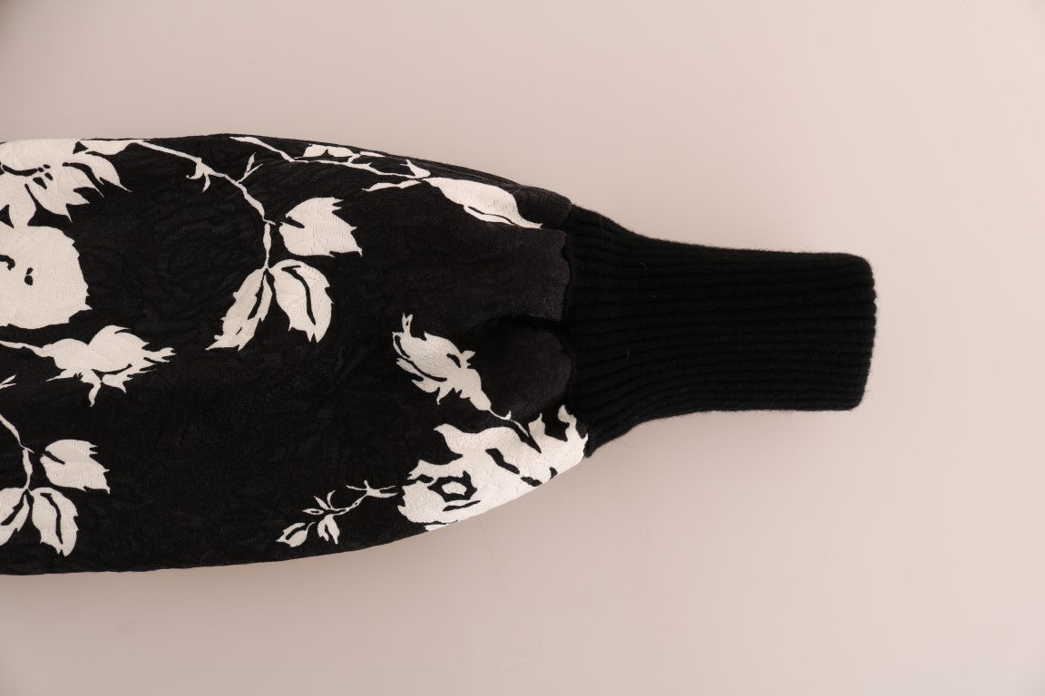 Pull Dolce & Gabbana en cachemire noir avec broderie florale en brocart et fermeture éclair, style élégant et sophistiqué.