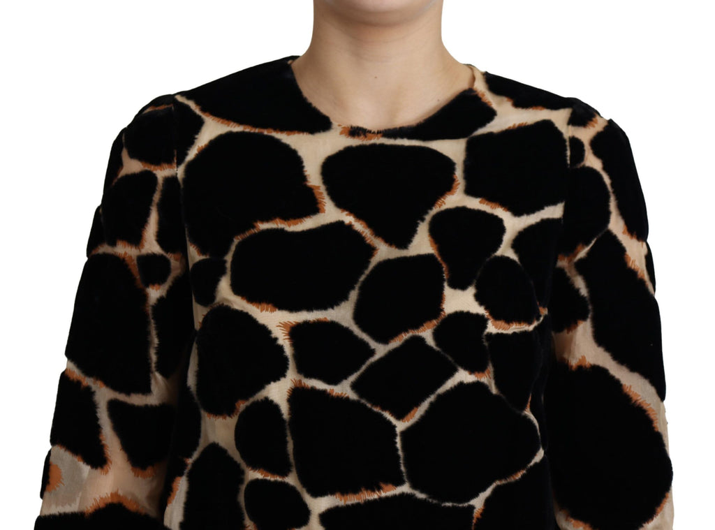 Robe courte noire Dolce & Gabbana à imprimé girafe, style décontracté, avec coupe fluide et détails tendance.
