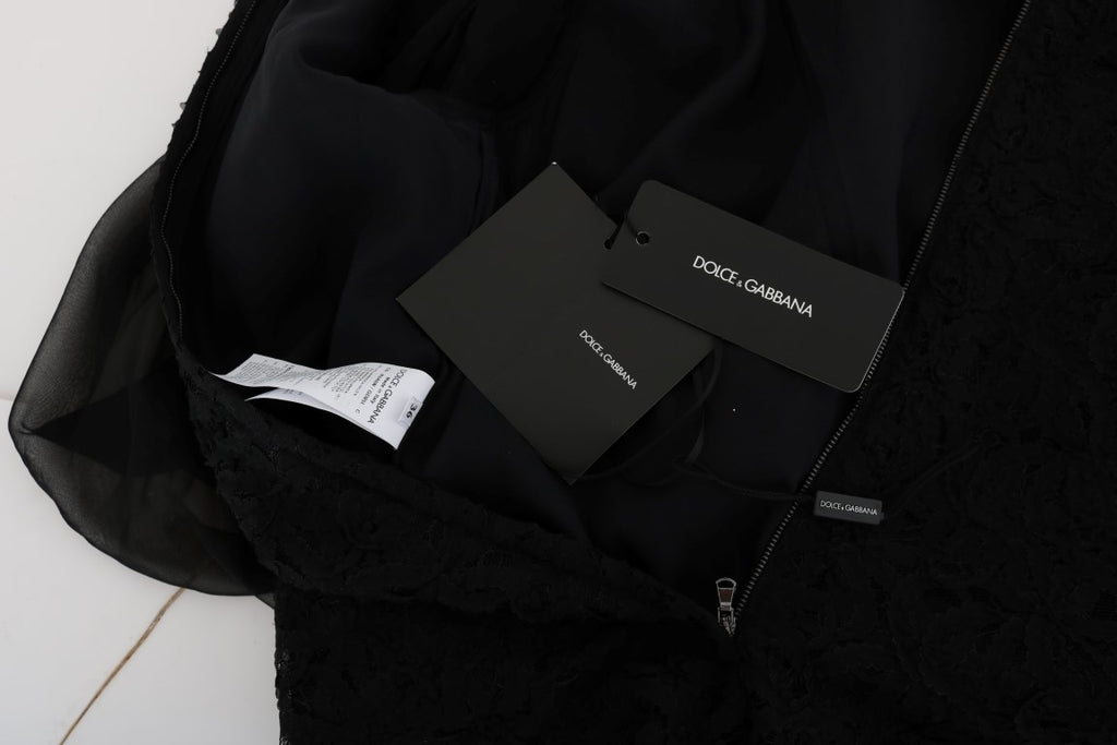 Robe trapèze noire en dentelle avec cœur rouge Dolce & Gabbana, élégante et féminine, vue de face sur fond blanc.