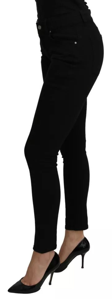 Jeans slim en coton stretch noir à taille mi-montante de Dolce & Gabbana, visibles avec une coupe ajustée.