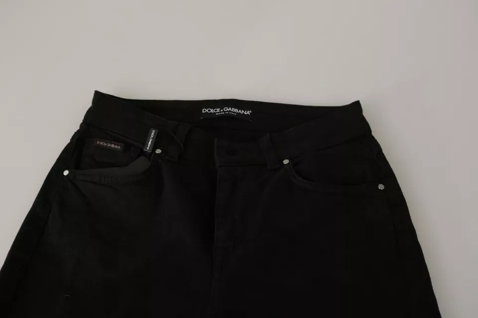 Jeans slim en coton stretch noir Dolce & Gabbana, taille mi-haute, coupe ajustée, visible sur un mannequin.
