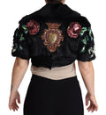 Manteau noir en fourrure de lapin avec cristaux et sequins de Dolce & Gabbana, détails élégants et sophistiqués visible sur l'image.