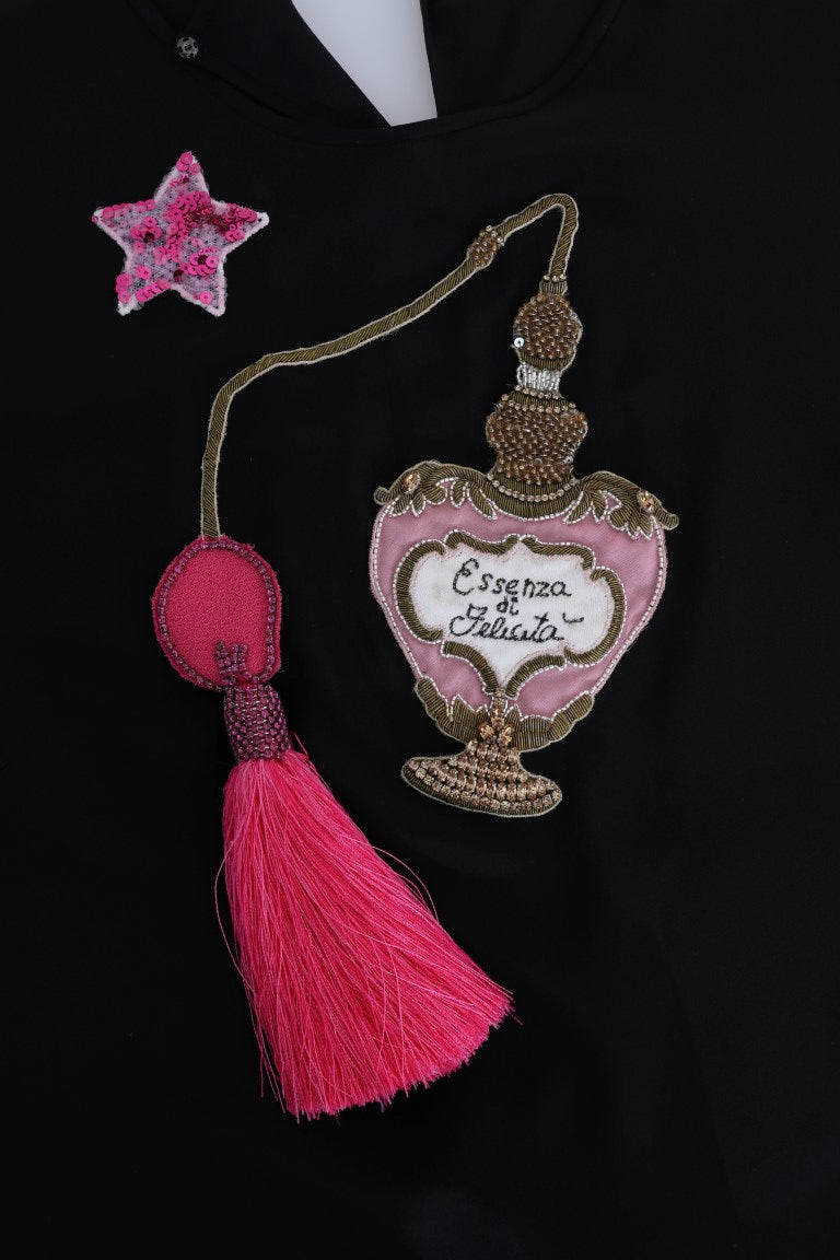 Haut en soie noire Dolce & Gabbana Fairy Tale avec cristaux, détail élégant et tissu fluide visible sur l'image.