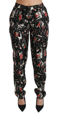Pantalon noir en soie Dolce & Gabbana, coupe mi-haute, avec ceinture élégante et détails sophistiqués.