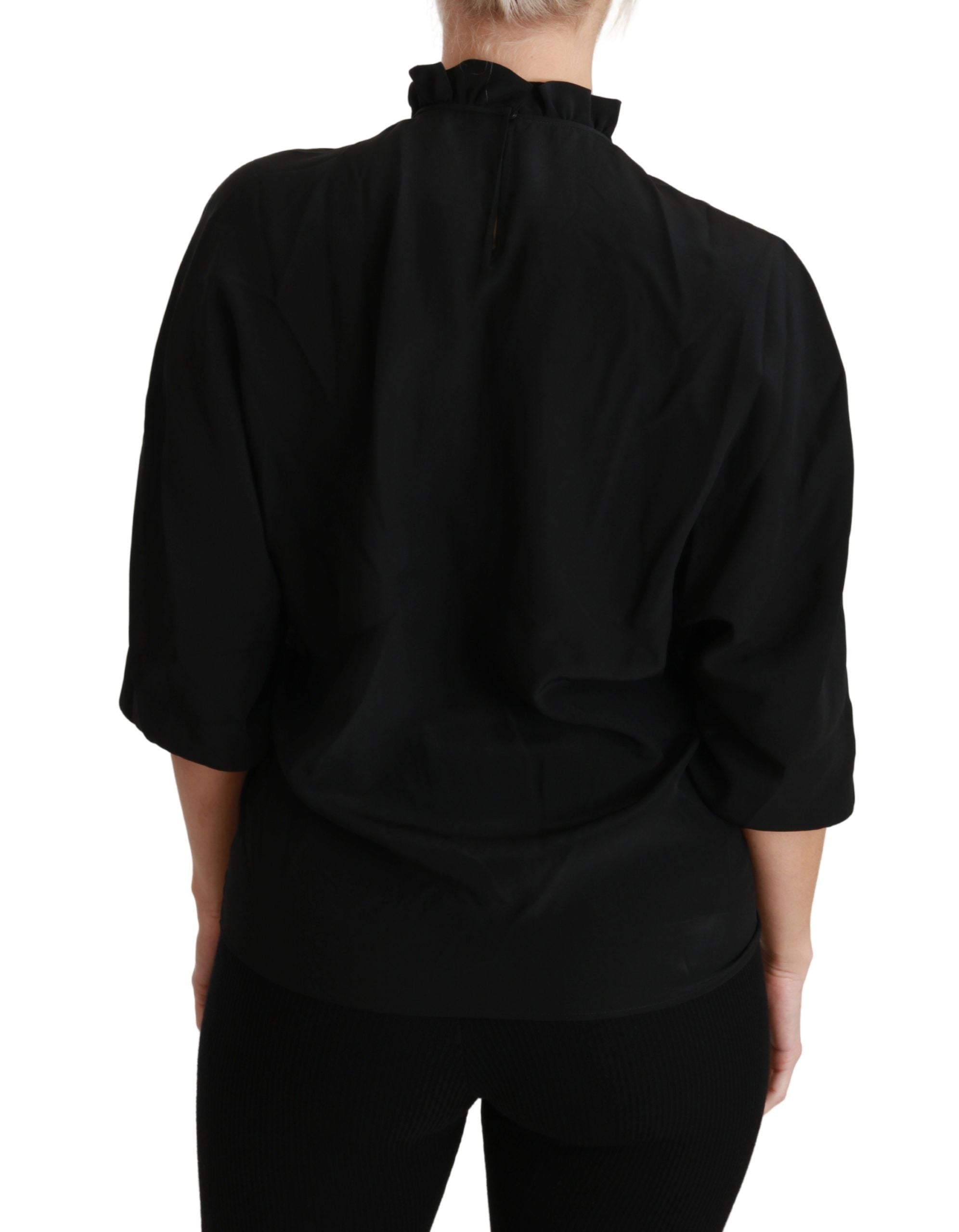 Chemise en soie noire Dolce & Gabbana avec col volanté et détails froncés, élégante blouse pour femme.