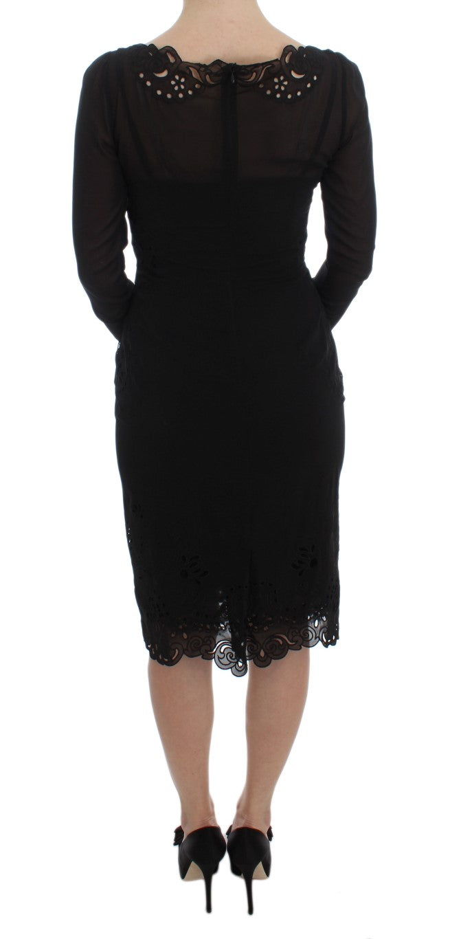 Robe noire en soie extensible Dolce & Gabbana, coupe près du corps, élégante et sophistiquée, vue de face sur mannequin.