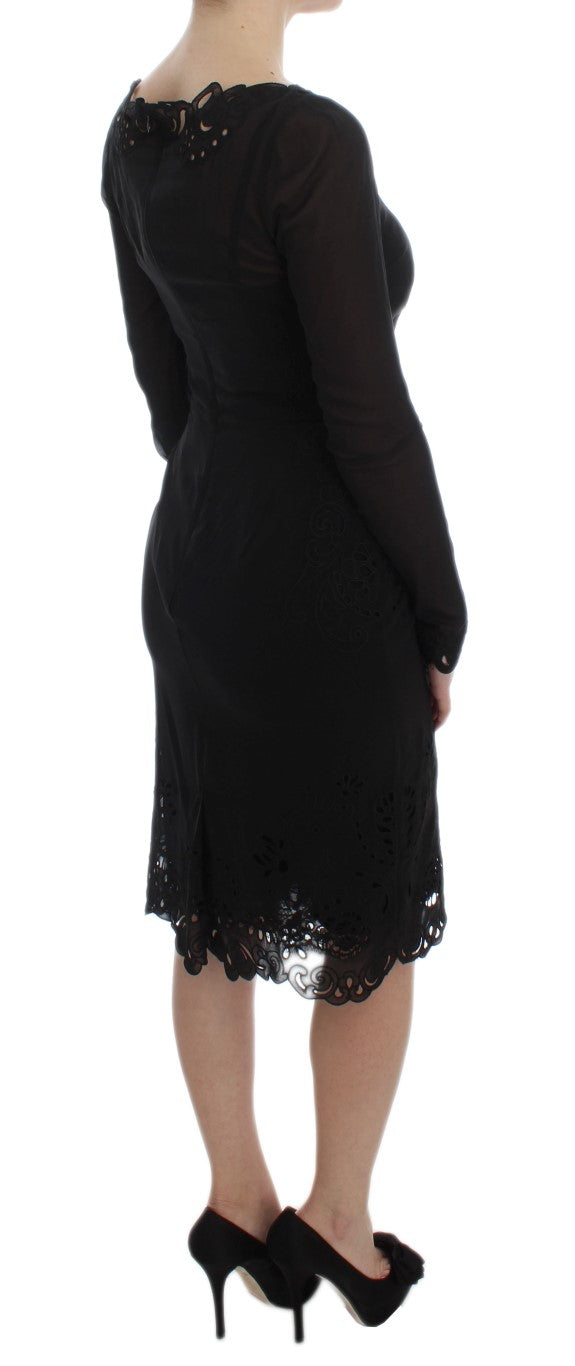Robe moulante en soie noire de Dolce & Gabbana, élégante et stretch, portée sur un mannequin.