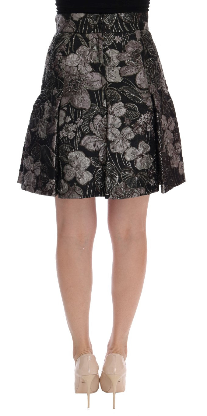 Jupe longue Dolce & Gabbana en brocart noir et argent avec motif floral, finition élégante et sophistiquée.