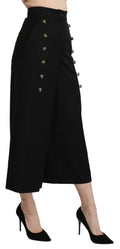 Pantalon large en laine noire Dolce & Gabbana, coupe cropped, avec jambes larges et style élégant.