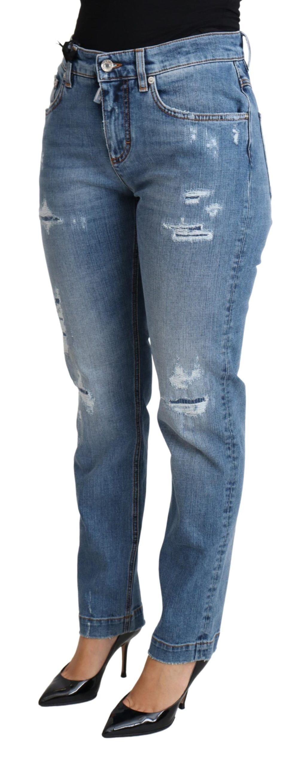 Jean skinny déchiré en denim bleu Dolce & Gabbana, coupe ajustée, coton mélangé, style décontracté et moderne.