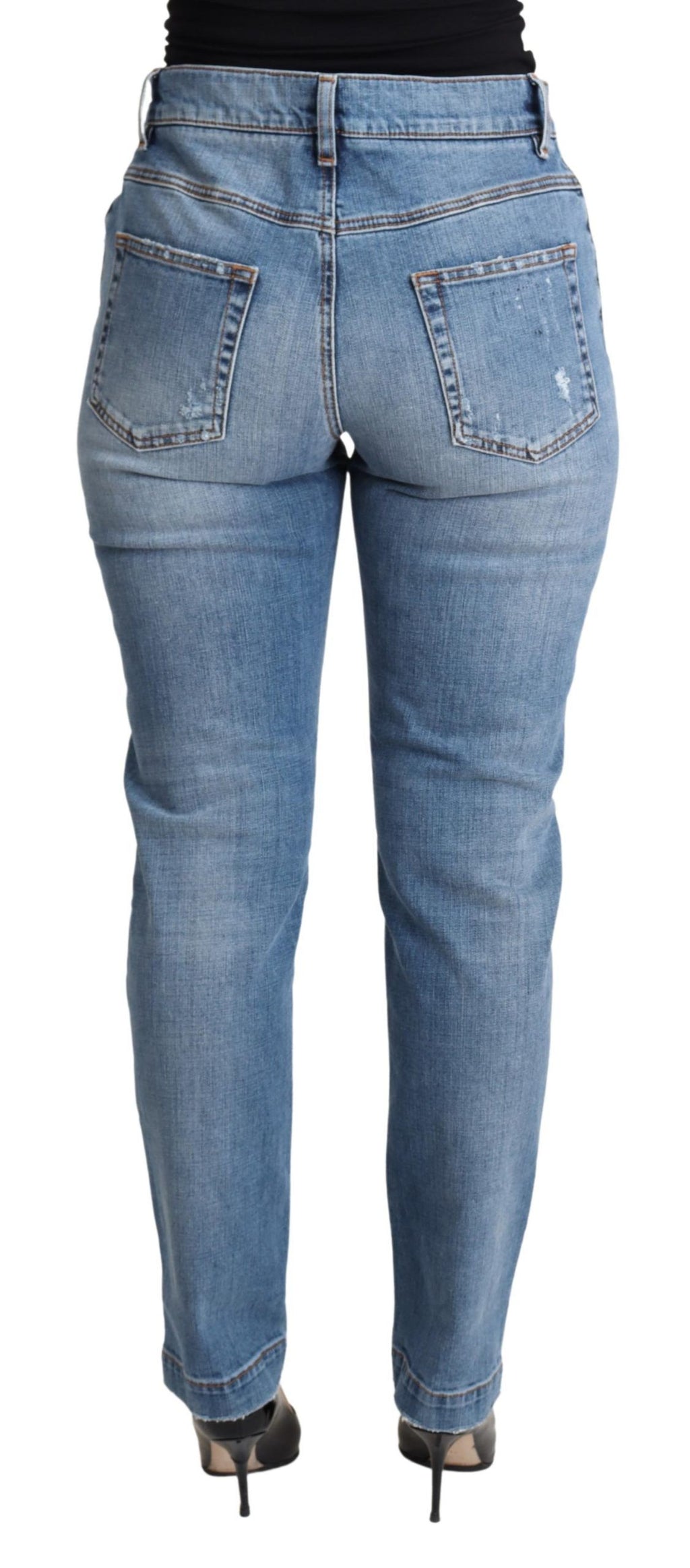 Jeans skinny en denim déchiré bleu Dolce & Gabbana, coupe ajustée, coton mélangé, style tendance et moderne.