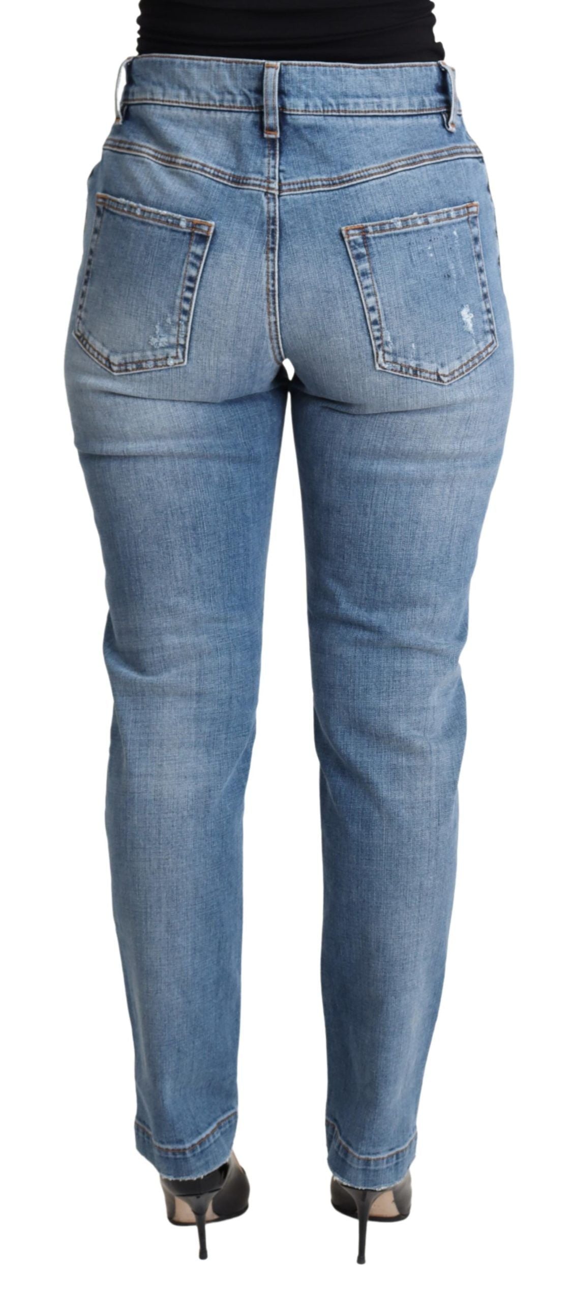 Jeans skinny en denim déchiré bleu Dolce & Gabbana, coupe ajustée, coton mélangé, style tendance et moderne.