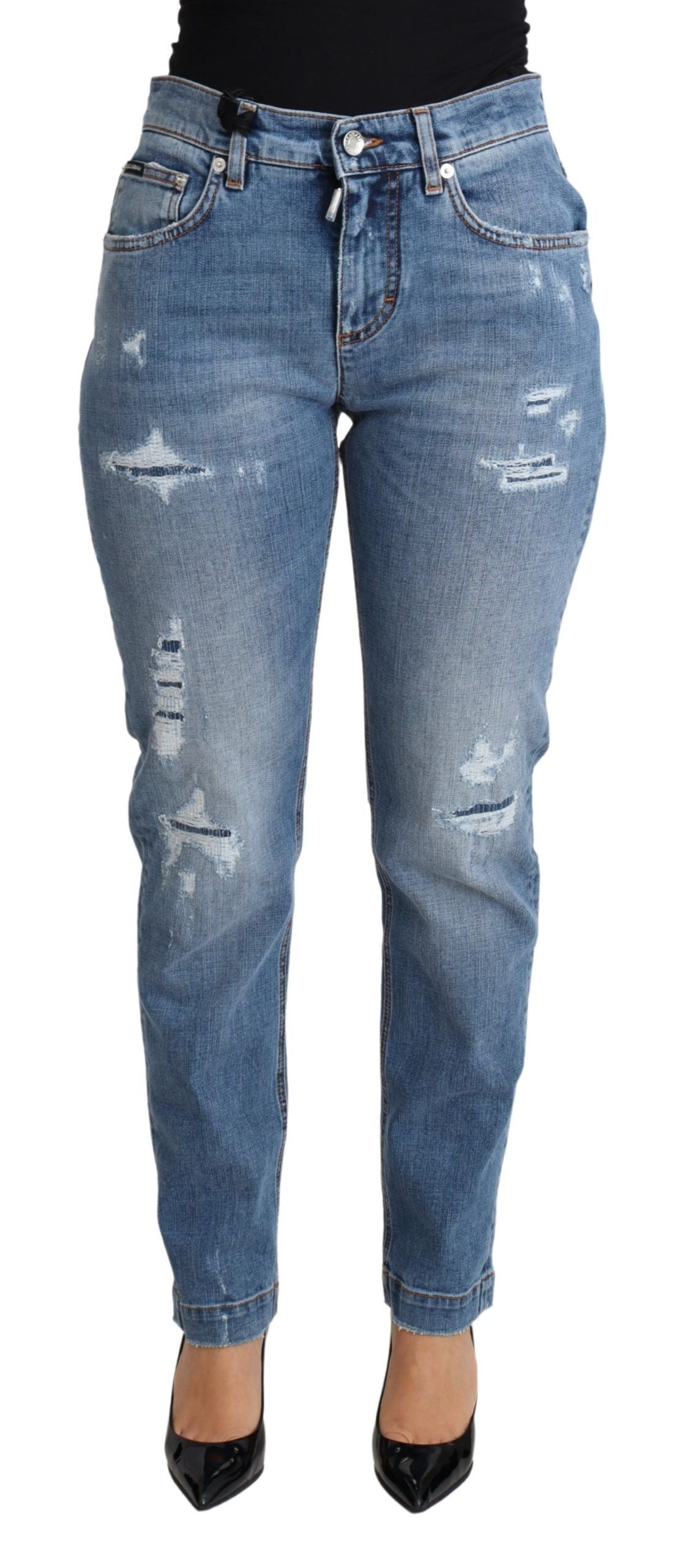 Jean skinny déchiré en denim bleu Dolce & Gabbana, coupe ajustée, coton mélangé, style tendance et moderne.