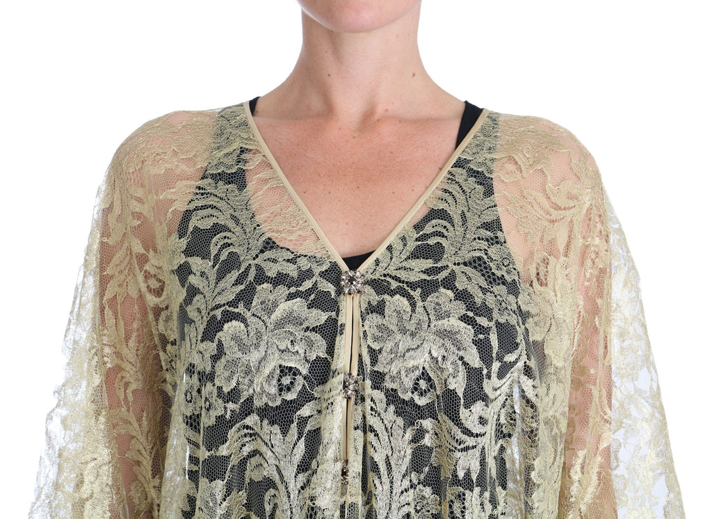Robe longue Dolce & Gabbana en dentelle florale dorée avec cape ornée de cristaux, élégante et sophistiquée.