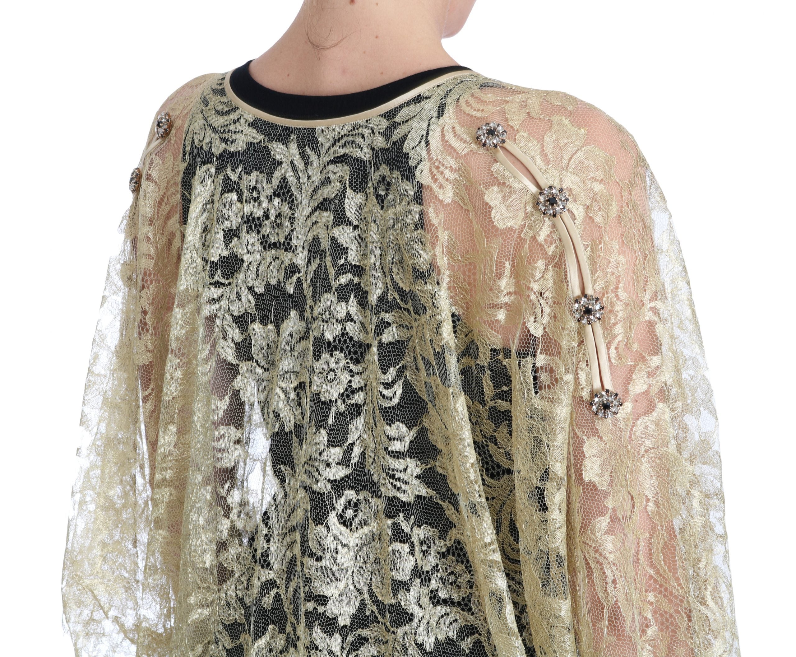 Robe longue Dolce & Gabbana en dentelle florale dorée avec cape ornée de cristaux, élégante et sophistiquée.