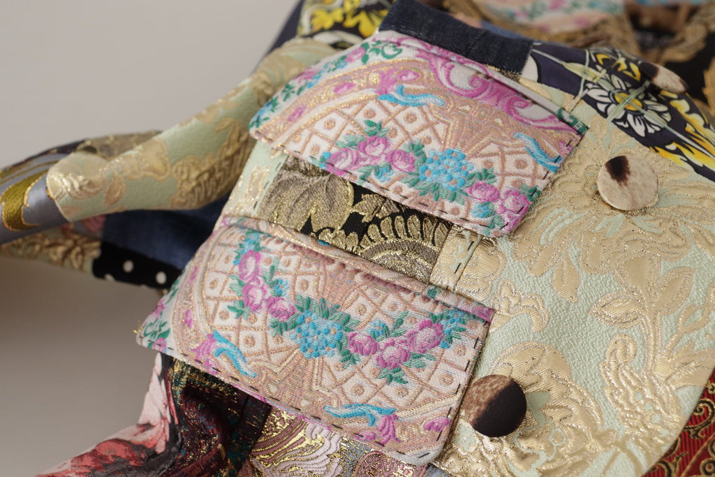 Blazer Dolce & Gabbana à double boutonnage, patchwork en jacquard multicolore, style élégant et sophistiqué.