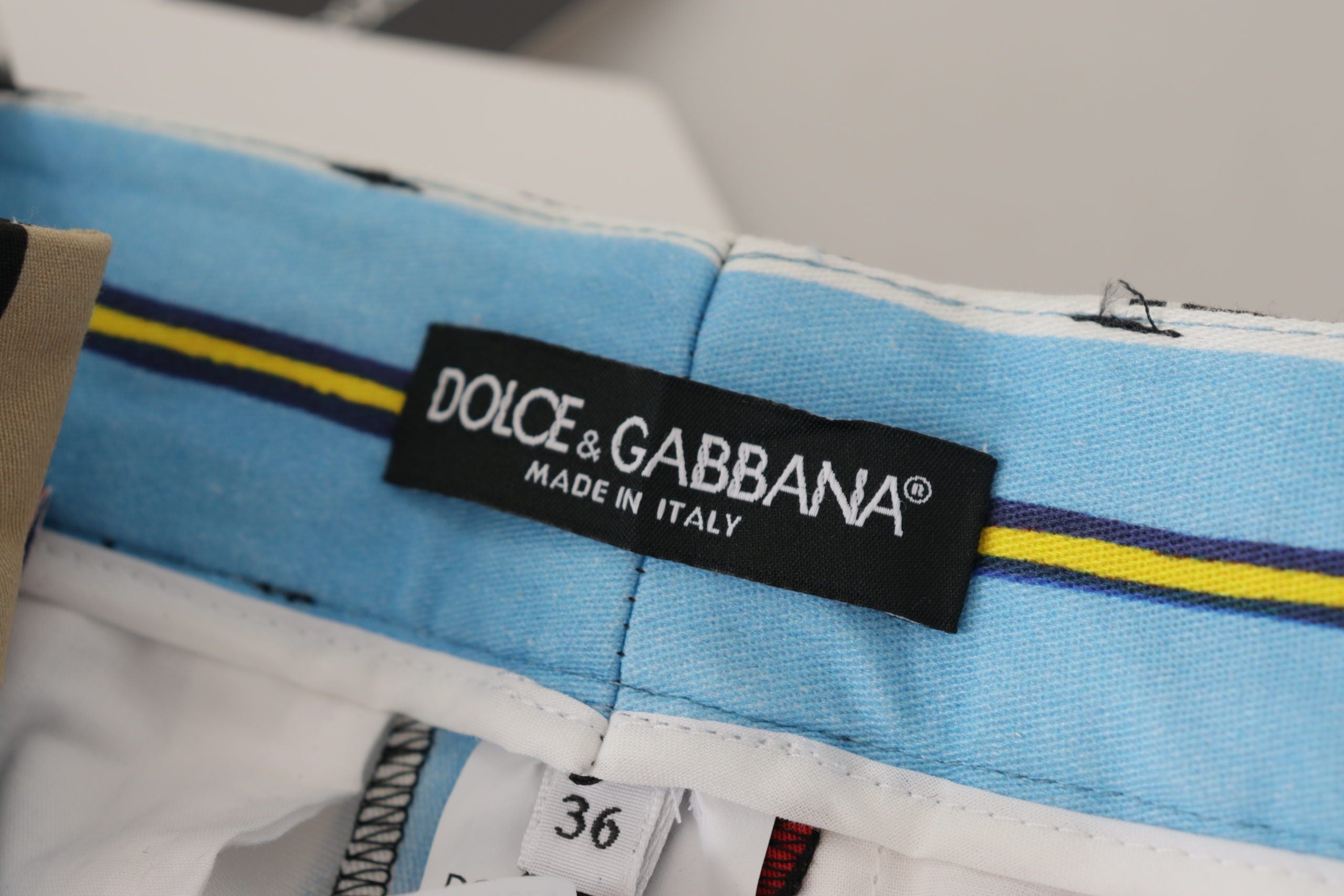 Pantalons en coton à rayures multicolores à taille haute de Dolce & Gabbana, vue de face sur fond neutre.