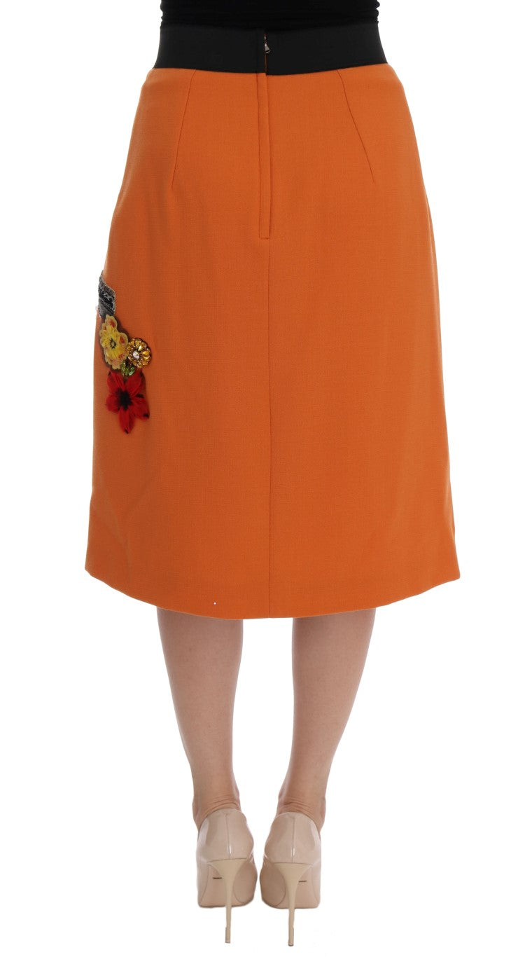 Jupe en laine orange Dolce & Gabbana avec appliques de cristaux et sequins, élégante et ornée de détails brillants.