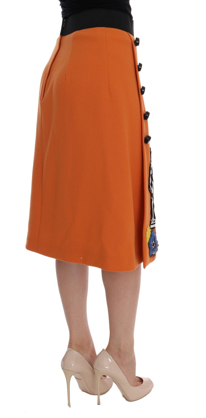 Jupe en laine orange Dolce & Gabbana avec appliqués en sequins et cristaux, élégante et ornée de détails brillants.