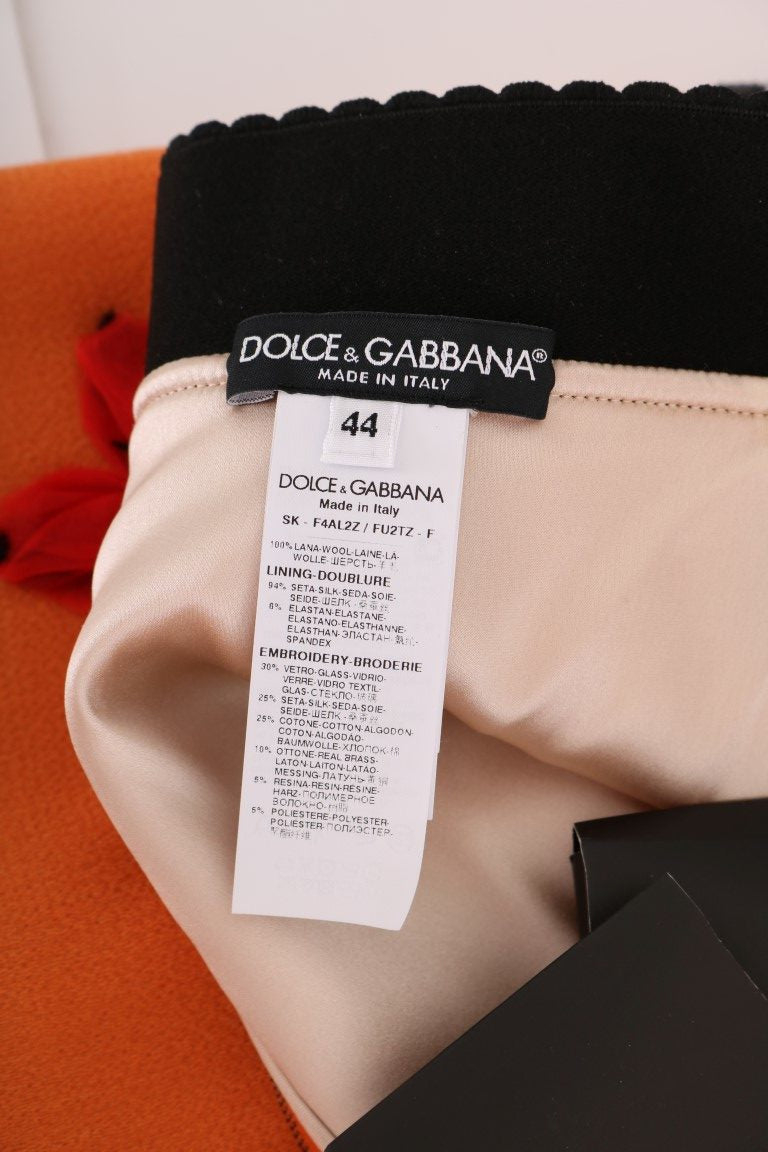 Jupe en laine orange Dolce & Gabbana avec appliqués en cristaux et sequins, élégante et ornée de détails brillants.