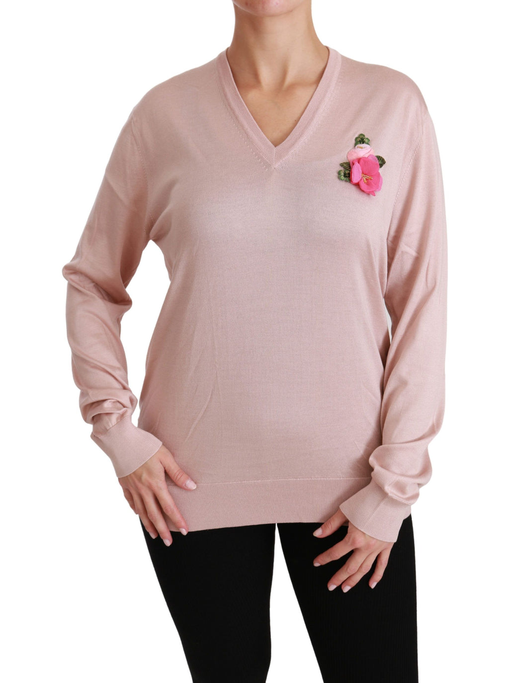 Pull à manches longues Dolce & Gabbana en soie rose avec embellissements floraux, style élégant et féminin.