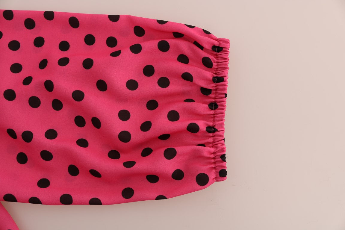 Chemise en soie rose à pois Dolce & Gabbana, blouse élégante avec motifs à pois, tissu fluide et détails raffinés.
