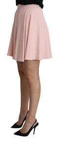 Jupon mini à plis plats et évasés de couleur rose, en rayonne, par Dolce & Gabbana, vue de face.