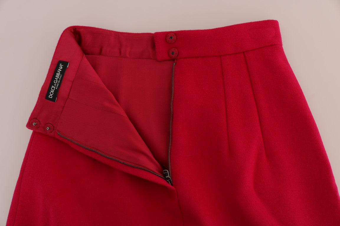 Jupe longue trapèze en laine rose de Dolce & Gabbana, longueur au genou, style élégant et féminin.