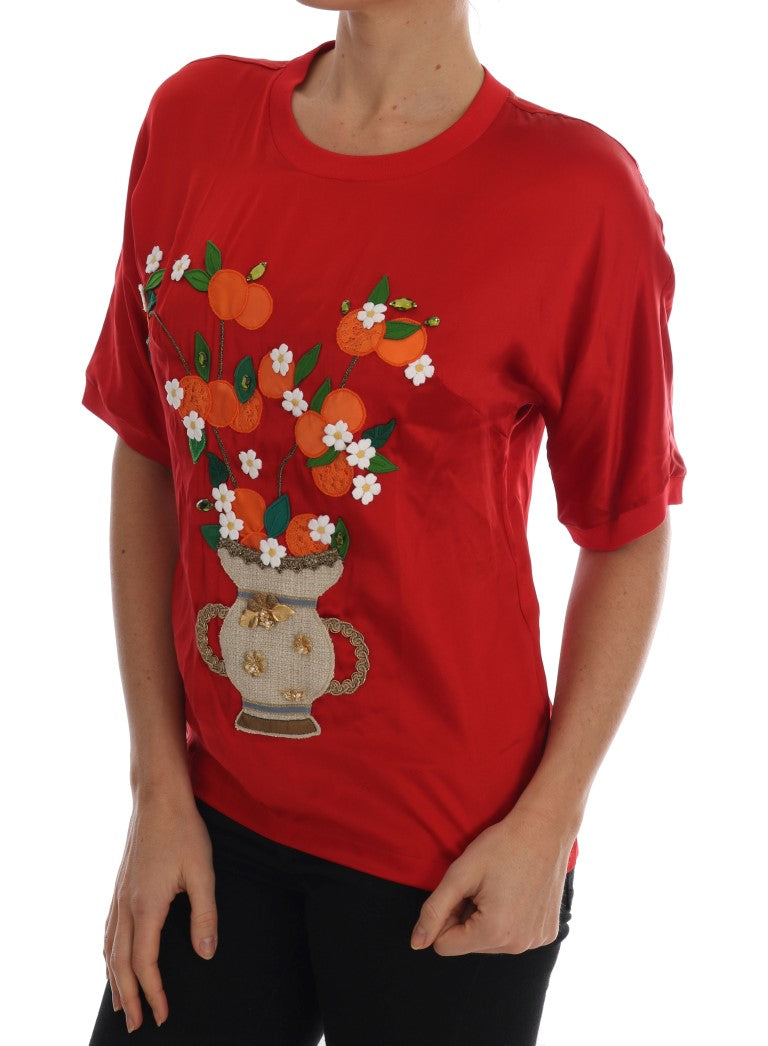 Vase en soie rouge et orange Dolce & Gabbana avec cristal au sommet, décoration élégante et raffinée.