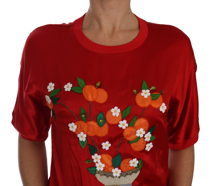 Vase en soie rouge et orange de Dolce & Gabbana avec un sommet en cristal, décoration élégante et raffinée.