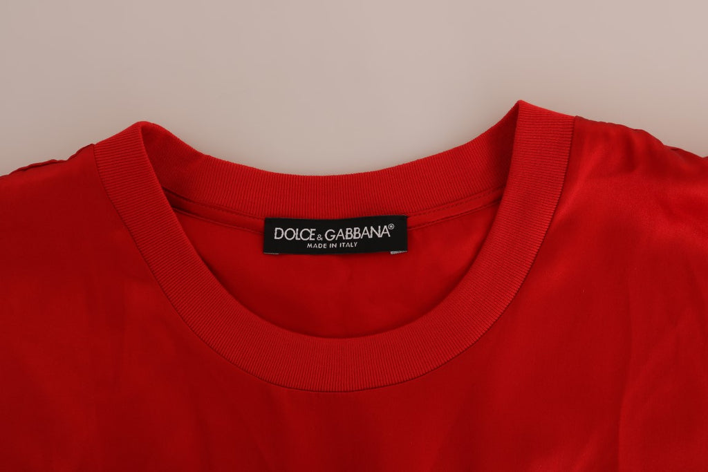 Vase en soie rouge orange de Dolce & Gabbana avec un sommet en cristal, décor élégant et sophistiqué.