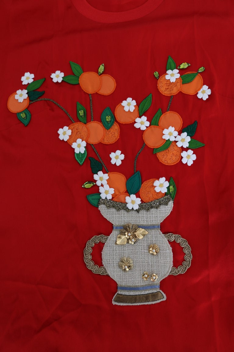 Vase en soie rouge orange Dolce & Gabbana avec cristal au sommet, décoration élégante et raffinée.