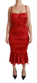 Robe sirène en soie rouge Dolce & Gabbana, moulante et élégante, mettant en valeur la silhouette.