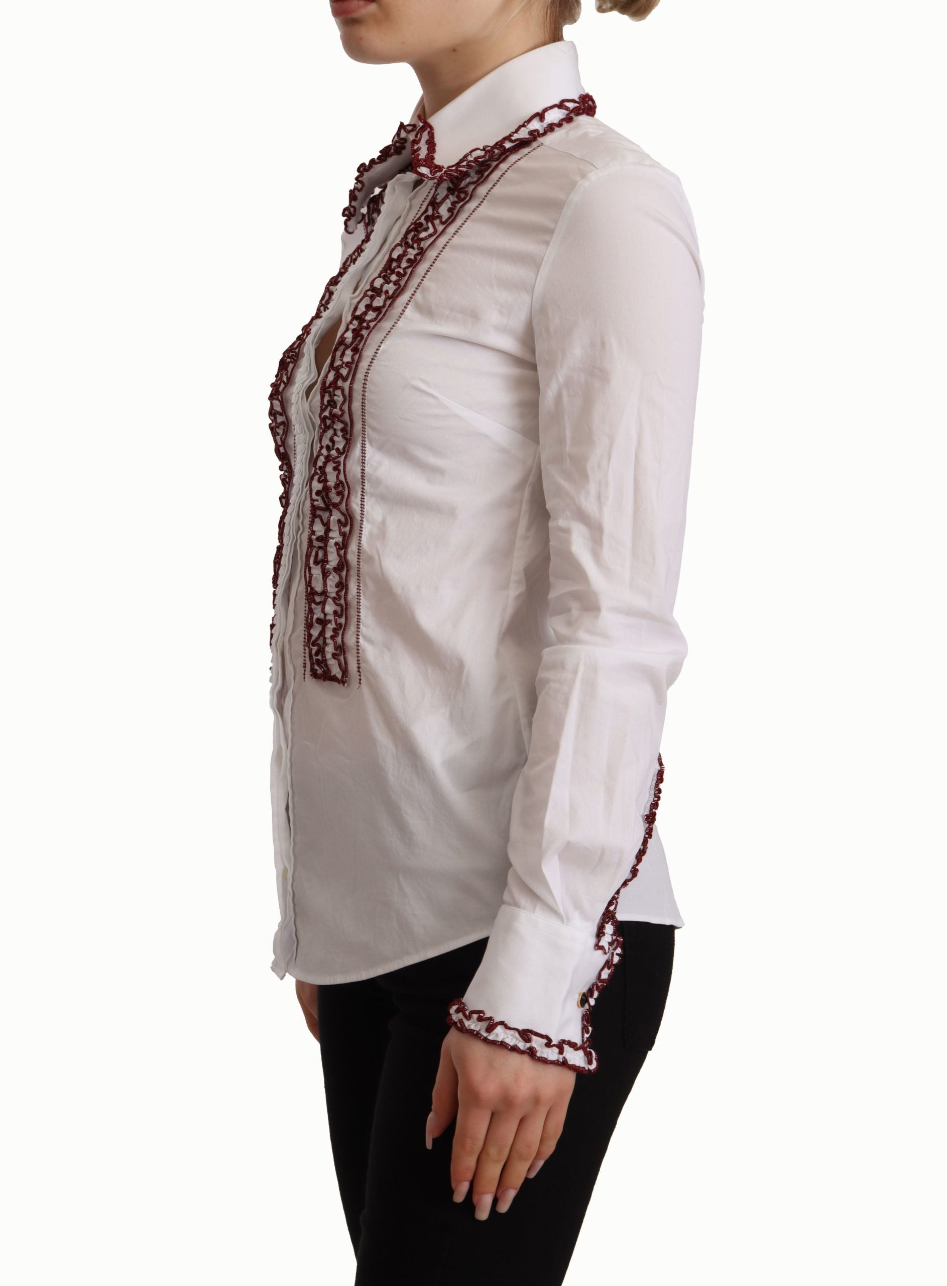 Chemise Dolce & Gabbana en coton blanc avec manches longues, col en dentelle et volant, élégante et raffinée.