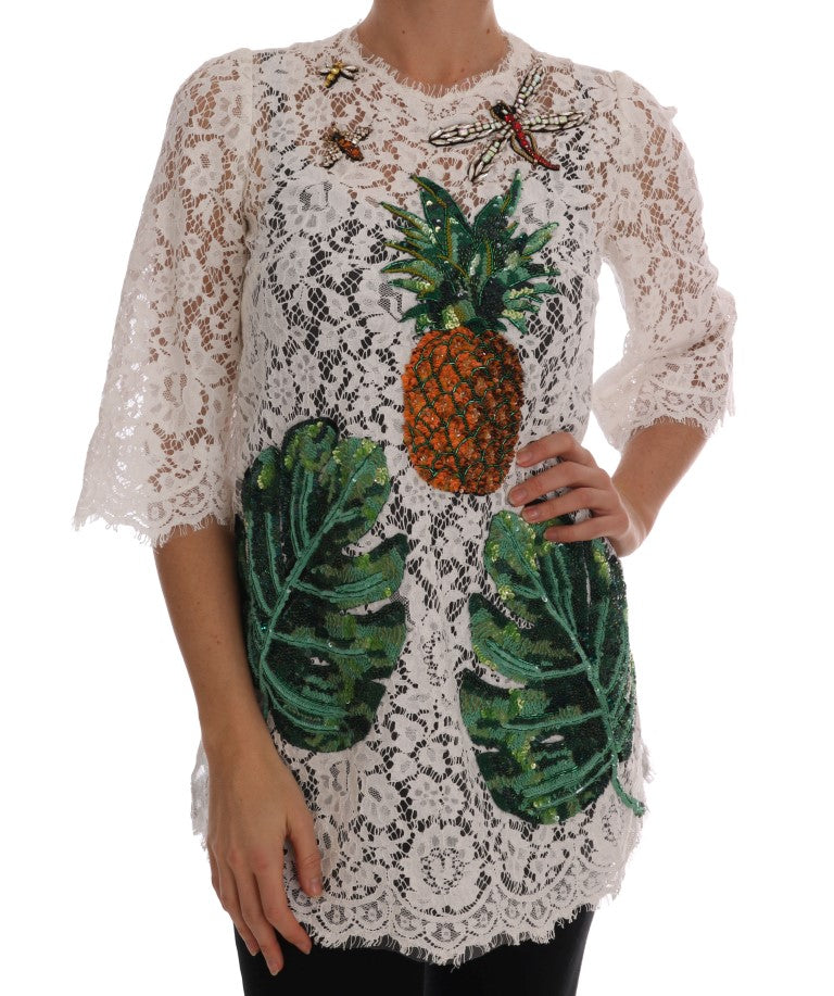 Blouse en dentelle blanche Dolce & Gabbana ornée de cristaux, vue de face, élégante et fine.