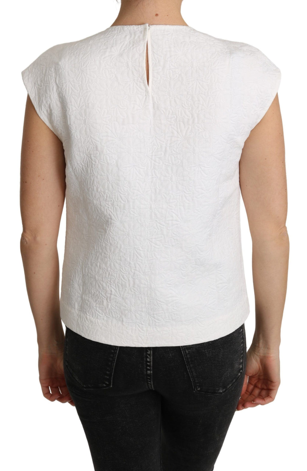Chemisier en brocart floral blanc Dolce & Gabbana en coton avec détails élégants, porté sur un mannequin.