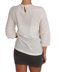 Blouse T-shirt en soie blanche Dolce & Gabbana avec logo #dgfamily, visible sur l'image.