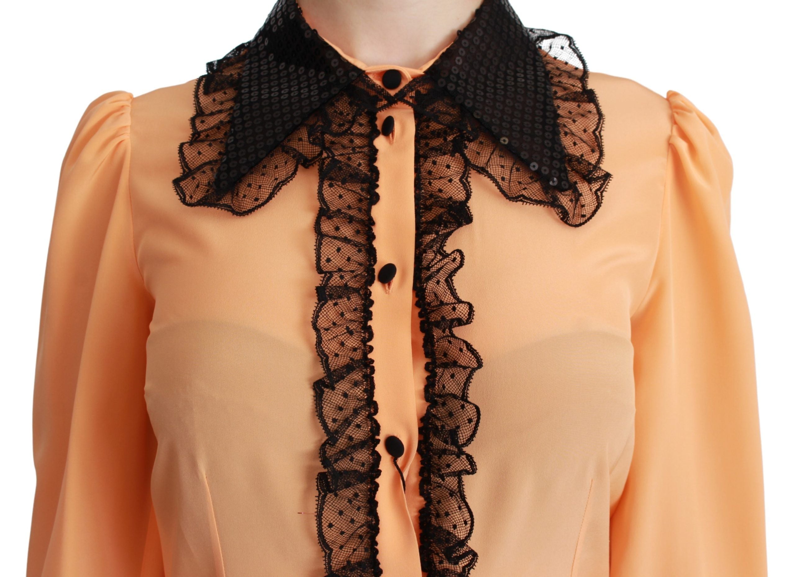 Chemise en soie jaune Dolce & Gabbana avec sequins et dentelle, détails élégants visibles sur l'image.