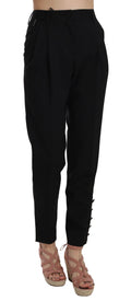 Pantalon noir Dolce & Gabbana avec boutons, plis et coupe tapered, vue de face, style élégant et moderne.