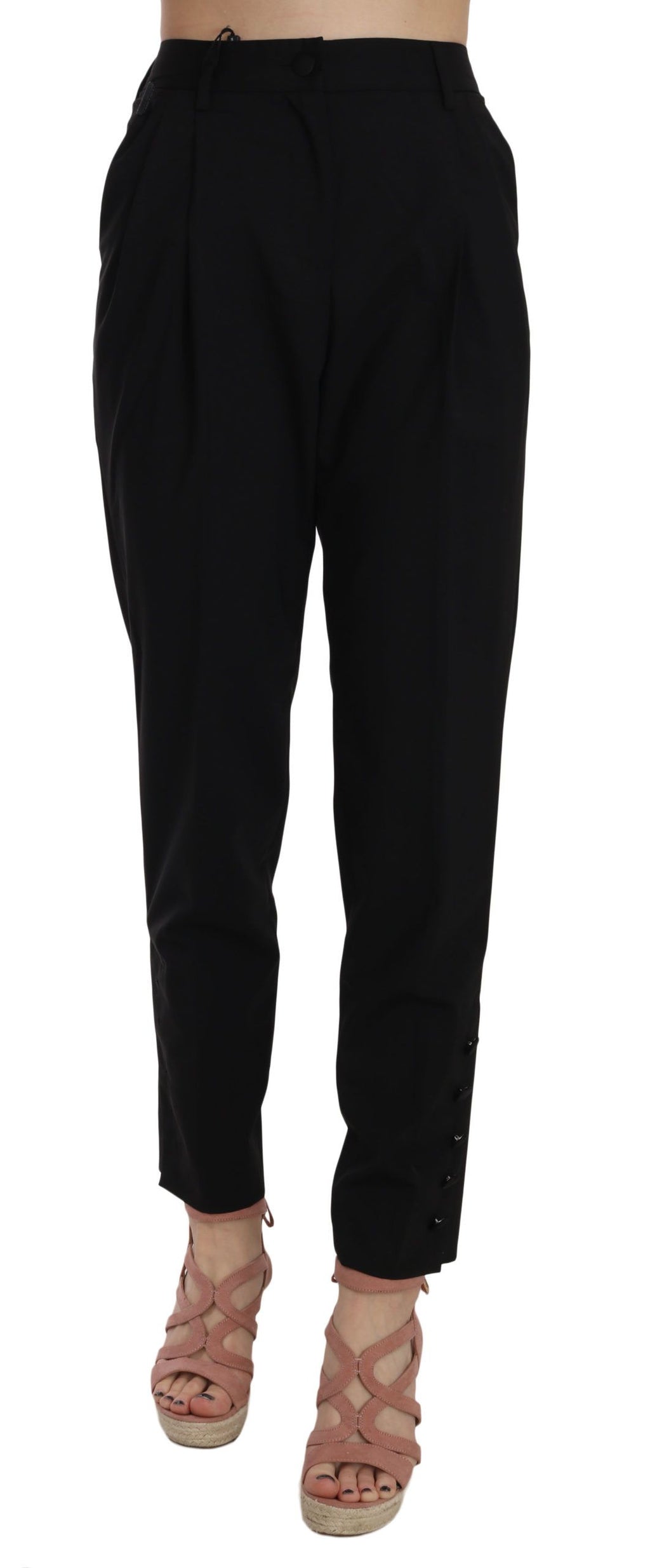 Pantalon noir Dolce & Gabbana avec boutons, plis et coupe taperée, vue de face sur un fond blanc.