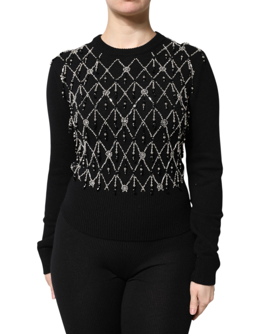 Pull Dolce & Gabbana en cachemire noir avec embellissements, manches longues et détails élégants visibles sur l'image.
