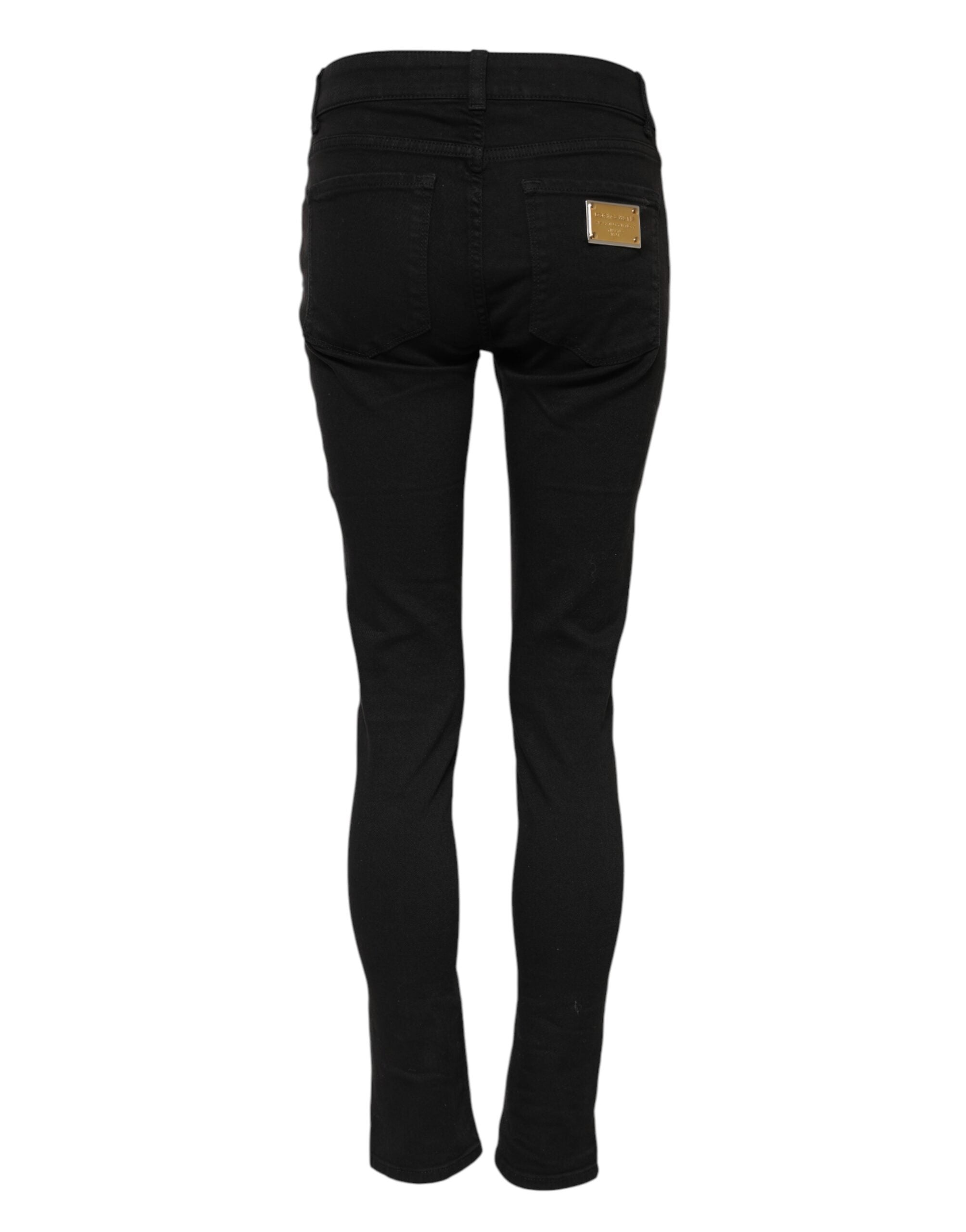 Jeans skinny en coton noir de Dolce & Gabbana, style décontracté et ajusté, visibles en gros plan sur l'image.